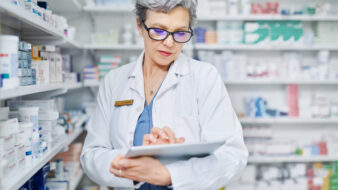 pharmacist working on a tablet device