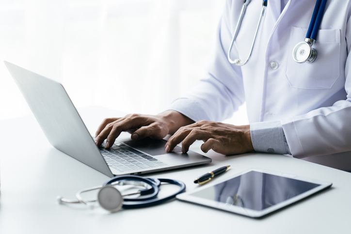 doctor working on a computer