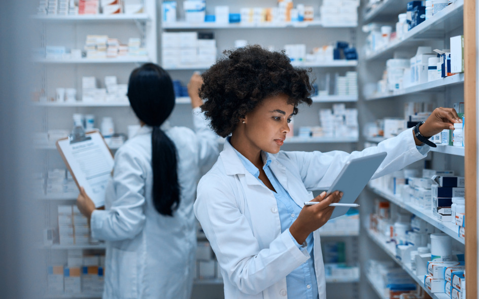 two pharmacists training in stock room