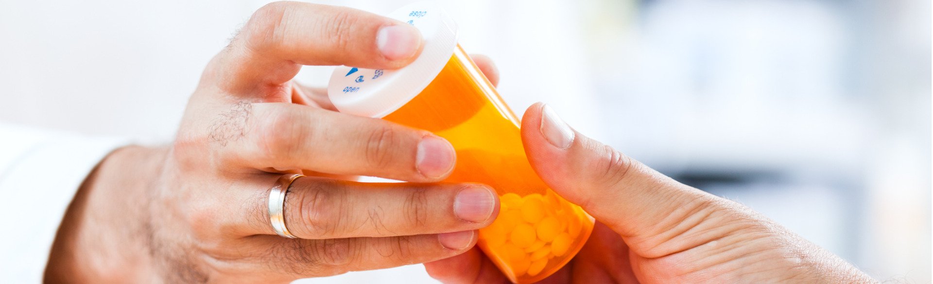 pharmacy technician giving medication to customer