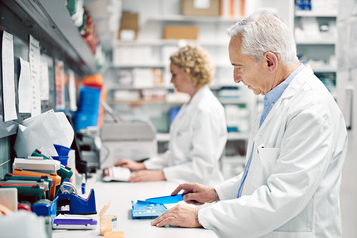 pharmacists counting tablet pill in the community pharmacy