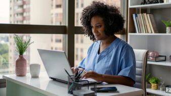 nurse working on her computer