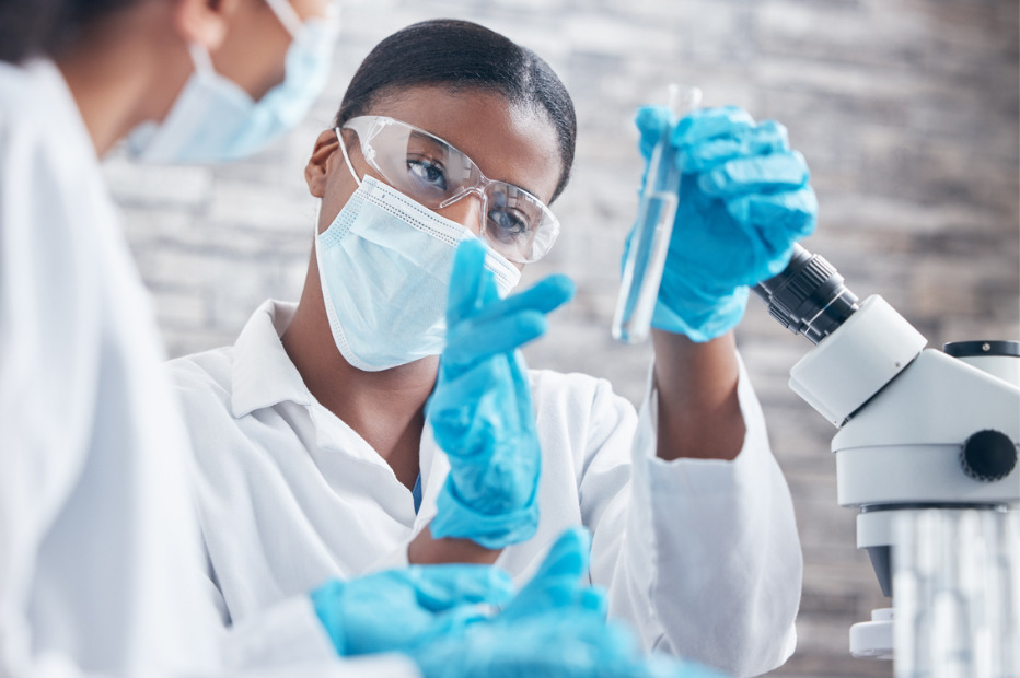 science working with test tubes in a lab
