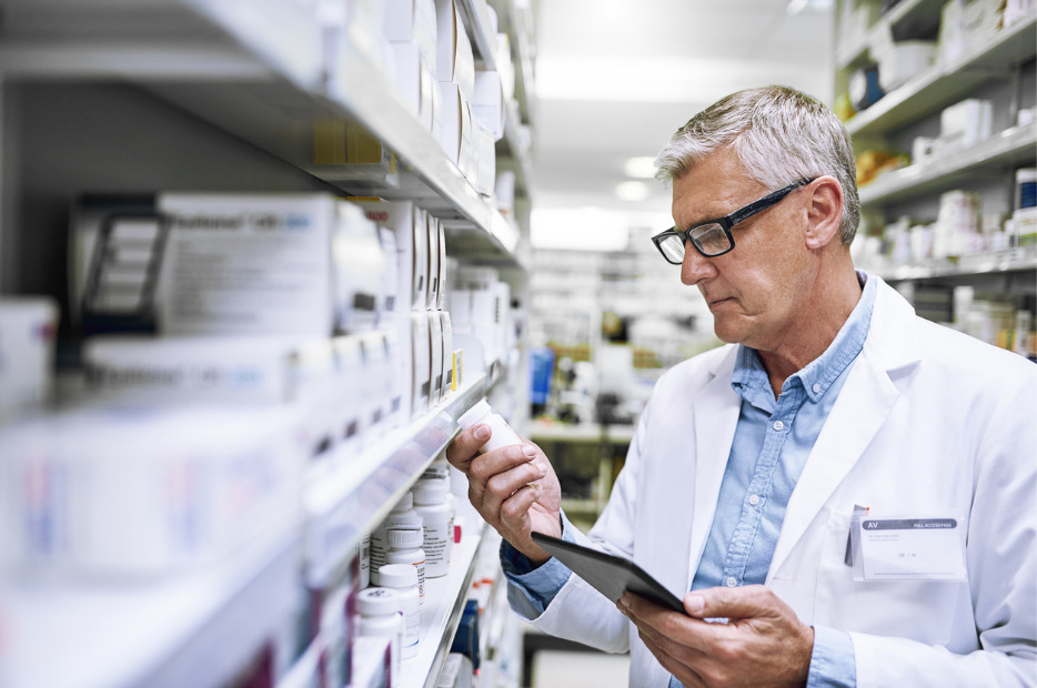 pharmacist looking at a medication