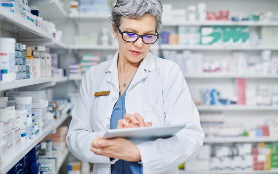 pharmacist working on a tablet device