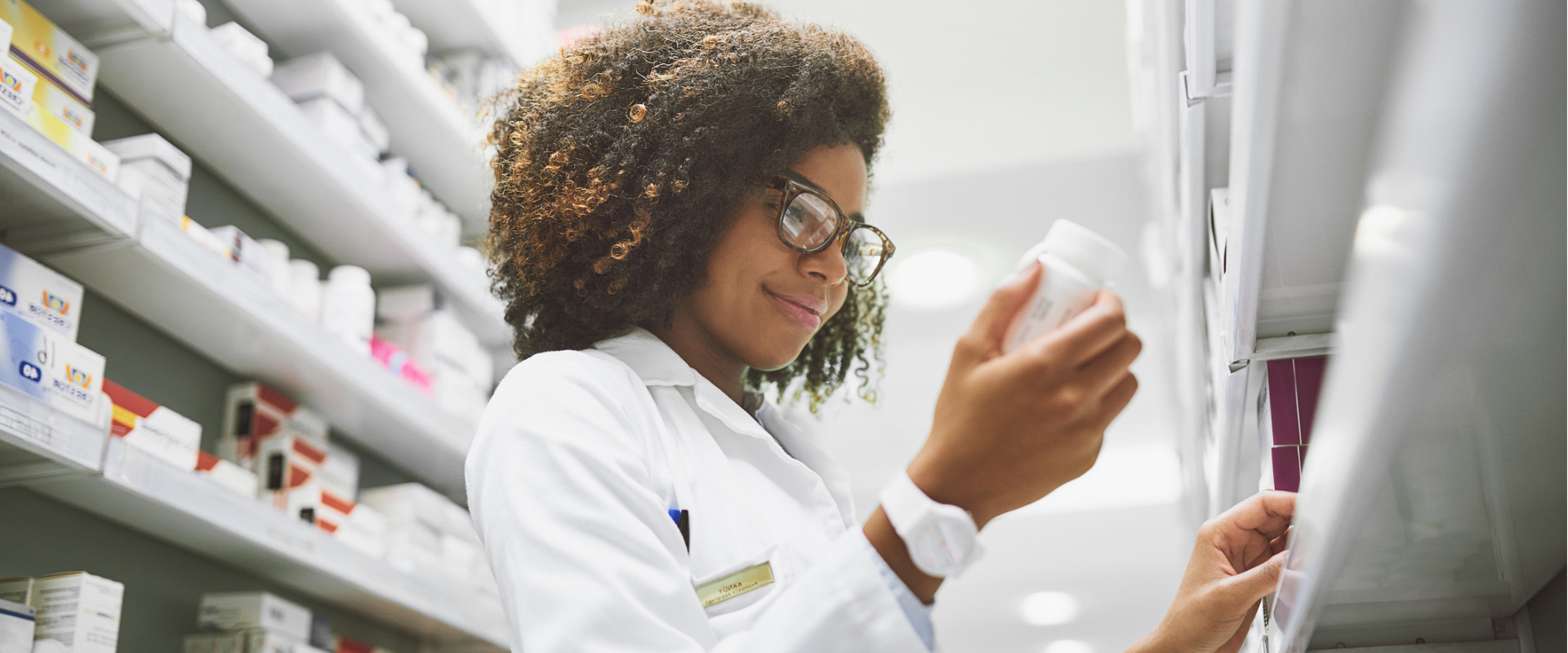 pharmacist looking at a medication