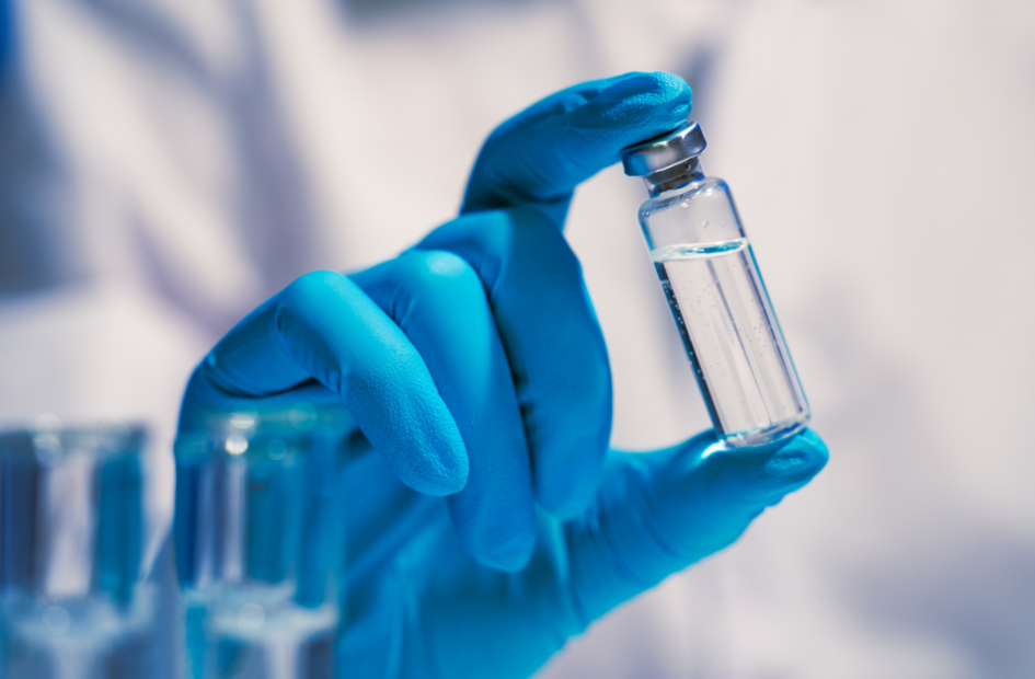 close up of a pharmacist holding a vaccine vial