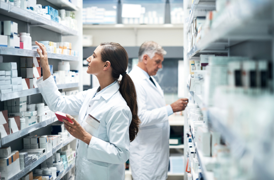 two pharmacists checking medication stock