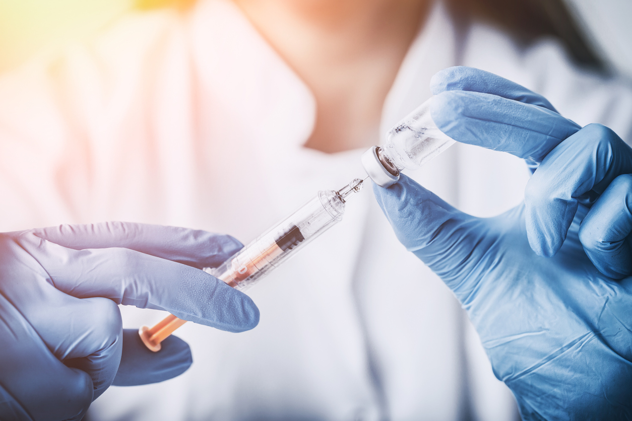 pharmacist holding vaccine