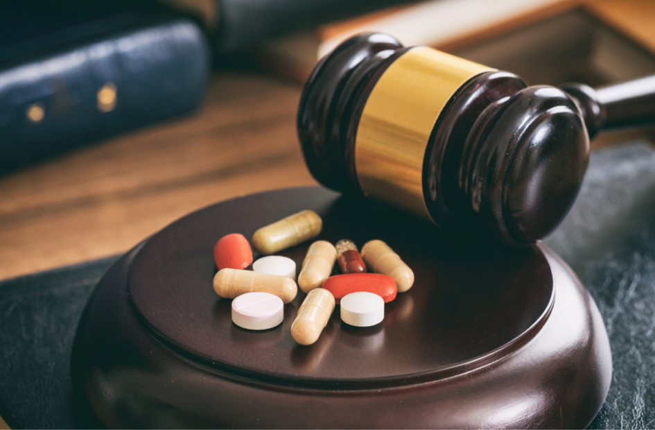 close up of a gavel and pills