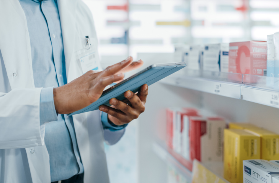 close up of a pharmacist looking at legislative tracking on a tablet device