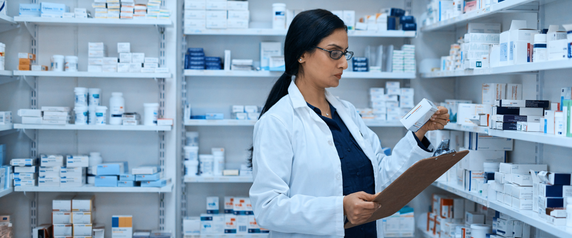 retail pharmacist looking at legislative tracking