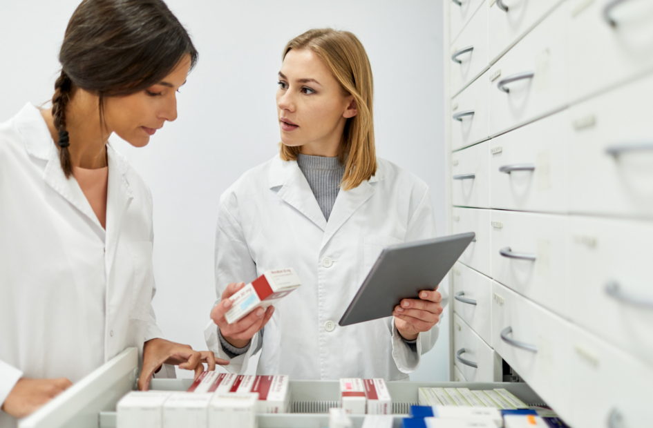 two pharmacists following standard operating procedures