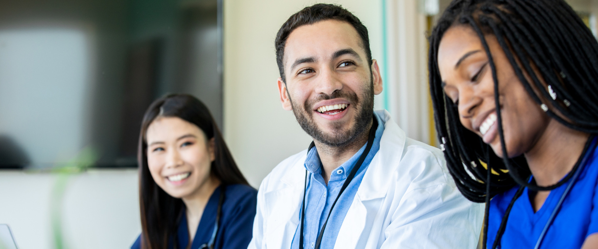 close up of healthcare professionals smiling