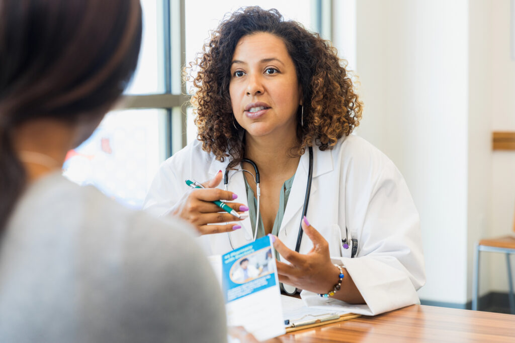 Nurse practitioner speaking with a patient