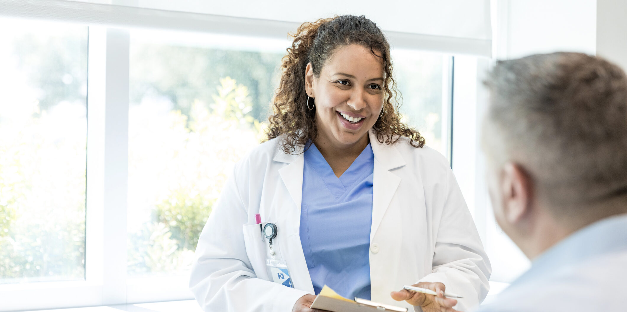 Hospital Pharmacist speaking with patient