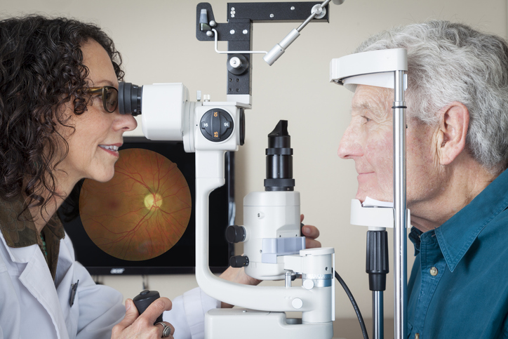 optometrist giving a patient an eye exam