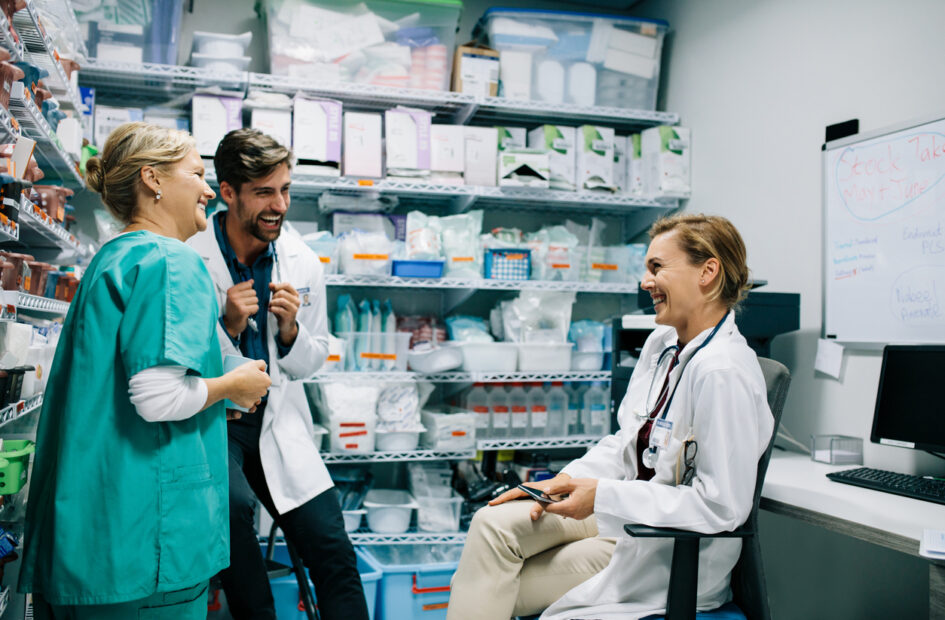 Hospital staff talking in pharmacy room